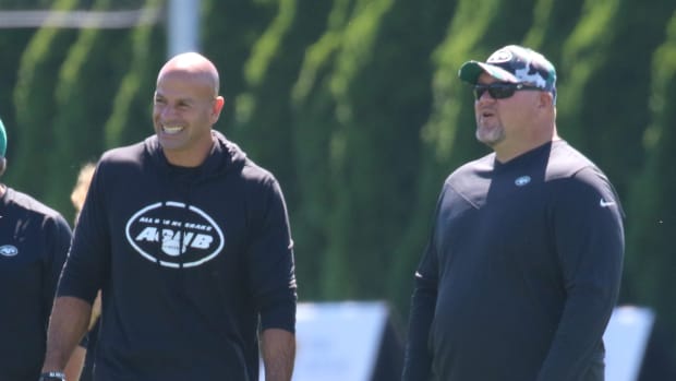 Robert Saleh and Joe Douglas on the practice field